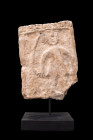 SOUTH ARABIAN STONE STELE

 Ca. 1st millennium BC
 A stone block fragment with incised characters in Ancient South Arabian script to the top edge a...