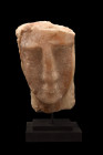 SOUTH ARABIAN ALABASTER FACE STELE

 Ca. 300 BC
 A hand-carved alabaster head of a man delineated in high relief, perhaps from a funerary stele, pr...