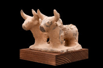 INDUS VALLEY TERRACOTTA PAIR OF BULLS

 Ca. 3000-2500 BC
 A pottery idol showcasing two zebu bulls standing in close proximity to one another on an...
