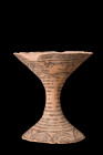 INDUS VALLEY TERRACOTTA CHALICE

 Ca. 3000-2500 BC
 A terracotta chalice cup, with its striking hourglass shape of a flared cup and splayed concave...