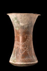 ANCIENT BRONZE VESSEL WITH ANIMALS

 Elamite, Ca. 2nd millennium BC
 A finely crafted bronze beaker boasting an exquisite concave body with an ever...