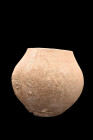 HOLY LAND STONE JAR

 Ca. 2nd-1st millennium BC
 A storage vessel, crafted from hard stone. Its delicate form features a skillfully carved globular...