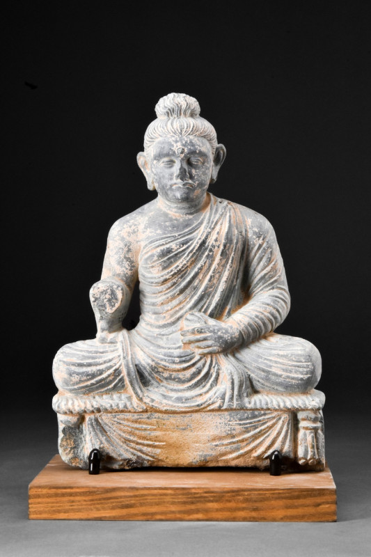 GANDHARAN SCHIST SEATED BUDDHA

 Ca. 200-300 AD
 A carved seated Buddha is an...