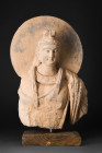 GANDHRAN SCHIST BUST OF BODHISATTVA

 Ca. 200-300 AD
 A schist bust of a Bodhisattva with his head, backed by a radiant halo, exudes a serene aura ...