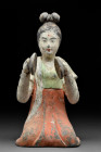 CHINESE TANG DYNASTY TERRACOTTA FEMALE MUSICIAN - TL TESTED

 Ca. 618-907 AD
 A terracotta figure of a kneeling female musician wearing a long flow...