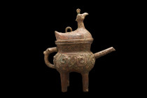 CHINESE ARCHAIC BRONZE POURING VESSEL WITH A BIRD-SHAPED LID

 Possibly Ming Dynasty, Ca. 1368-1644 AD
 A bronze ritual pouring vessel with a squat...