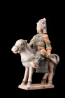 CHINESE MING DYNASTY GLAZED TERRACOTTA RIDER ON A HORSE

 Ca. 1368-1644 AD, or later
 A ceramic figure depicting an elegant horse standing atop of ...