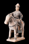 CHINESE MING DYNASTY GLAZED TERRACOTTA RIDER ON A HORSE

 Ca. 1368-1644 AD, or later
 A ceramic figure portraying a horserider sitting atop a horse...