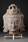 CHINESE STONE HEAD OF BODHISATTVA

 Sui Dynasty, ca. 581-618 AD or later
 A stone head of a Bodhisattva depicted with a regal headdress and elabora...