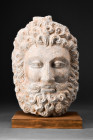 GANDHARAN HEAD OF HERCULES

 Ca. 100-200 AD
 A schist head of Hercules with finely carved facial features, from the almond-shaped eyes with heavy e...