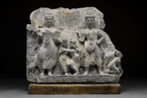 GANDHARAN RELIEF OF TWO BODHISATTVA

 Ca. 200-300 AD
 A grey schist carved relief depicting two standing figures of Bodhisattva; on the left Bodhis...