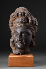 GANDHARAN DARK SCHIST HEAD OF BODHISATTVA

 Ca. 200-300 AD
 A carved dark schist head of a bodhisattva with its soft, rounded cheekpieces, lovely s...