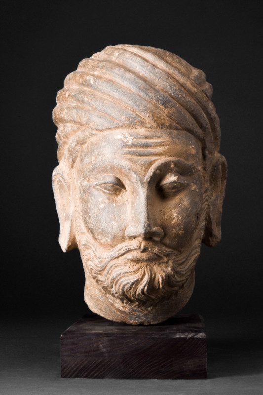 GANDHARAN SCHIST HEAD OF A NOBLEMAN

 Ca. 200-300 AD or later
 A mesmerizing ...