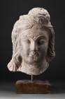 GANDHARAN SCHIST HEAD OF BODHISATTVA

 Ca. 200-300 AD
 A schist head of a Bodhisattva, a stunning masterpiece of art that embodies the profound spi...