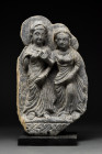 GANDHARAN SCHIST RELIEF PANEL WITH PANCHIKA AND HARITI

 Ca. 300 AD
 A schist carving depicting a standing couple, most probably Hariti and Panchik...