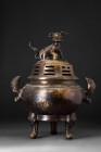 CHINESE BRONZE CENSER 

 Qing Dynasty, Ca. 1644-1912 AD
 A bronze tripod censer standing proudly on three feet, each one adorned with intricately d...