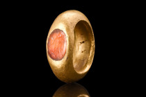 STUNNING ROMAN GOLD RING WITH VICTORY INTAGLIO - 49 GRAMS

 Ca. 200-300 AD
 A gold Legionary finger ring of a D-shaped hoop with a rounded exterior...