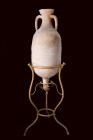 ROMAN TERRACOTTA AMPHORA

 Ca. 1st century BC - 1st century AD
 A terracotta amphora featuring a bulbous, elongated body that seamlessly flows into...