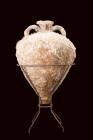 ROMAN TERRACOTTA AMPHORA

 Ca. 2nd-3rd century AD
 A Gauloise Type 4 terracotta amphora. This stunning piece features an inverted pear-shaped body,...
