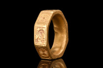 RARE MEDIEVAL GOLD ICONOGRAPHIC RING - WITH REPORT

 Ca. 1400 - 1500 AD
 A gold finger ring featuring a rectangular-section hoop of massive, octago...