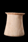 EGYPTIAN ALABASTER VESSEL

 New Kingdom, ca. 1550-1070 BC
 This cylindrical wonder is expertly sculpted from alabaster, a stone prized for its uniq...