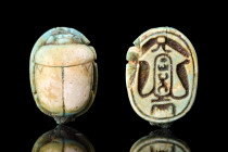 EGYPTIAN STEATITE THUTMOSE SCARAB

 Ca. 1504-1450 BC
 This green-glazed steatite scarab is inscribed with the cartouche of Thutmose III of Dynasty ...