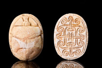 EGYPTIAN STEATITE SCARAB WITH SEMA-TAWY

 Ca. 1938-1292 BC
 A fine Egyptian steatite scarab with naturalistic features such as a clypeus and protho...
