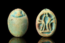 EGYPTIAN GLAZED STEATITE SCARAB WITH WEDJAT-EYE

 Ca. 1070-664 BC
 An interesting glazed steatite scarab with incised detail to the top to form nat...
