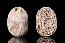 EGYPTIAN CANAANITE SCARAB WITH LION

 Ca. 1550 BC
 A fine cream-coloured steatite scarab with naturalist features, the reverse depicted a walking l...
