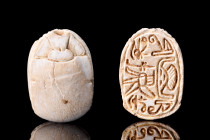 EGYYPTIAN STEATITE SCARAB

 Ca. 1938-1292 BC
 A fine steatite scarab with naturalistic features including clypeus and prothorax marked by incised l...