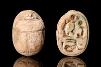 EGYPTIAN STEATITE SCARAB

 Ca. 1938-1292 BC
 Scarab carved from light green glazed steatite decorated with naturalistic features including clypeus ...