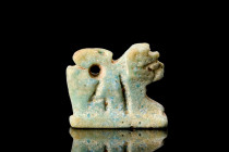 EGYPTIAN FAIENCE RECUMBENT LION AMULET

 Ca. 332-30 BC
 A fine pale turquoise glazed faience amulet in the form of a recumbent lion, on an integrat...