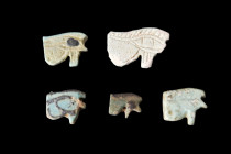 EGYPTIAN GROUP OF WEDJAT-EYE AMULETS

 Ca. 664-30 BC
 A group of well-defined wedjat eyes, with fine details, notched eyebrows. The amulet is horiz...