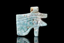 EGYPTIAN FAIENCE WEDJAT AMULET

 Ca. 664-332 BC
 A glazed turquoise faience wedjat amulet, more commonly known as the Eye of Horus, featuring a loo...