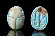 EGYPTIAN BLUE GLAZED STEATITE SCARAB INSCRIBED TO AMUN

 Ca. 1550-1070 BC
 An extremely fine example of an amulet in the shape of a scarab with fea...
