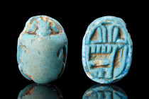 EGYPTIAN GLAZED STEATITE SCARAB

 Ca. 1070-664 BC
 A bright blue steatite scarab with naturalistic features including clypeus and prothorax. The fl...