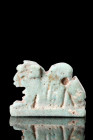 EGYPTIAN FAIENCE RECUMBENT LION AMULET

 Ca. 332-30 BC
 A fine pale turquoise glazed faience amulet in the form of a recumbent lion, on an integrat...