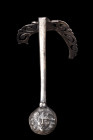ROMAN SILVER JUG HANDLE

 Ca. 1-100 AD
 A silver handle likely to have been part of a jug. At one end, a round finial featuring a face with flowing...