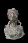 ROMAN BRONZE PROTOME OF A GODDESS

 Ca. 100-200 AD
 A bronze protome of a goddess with her head slightly tilted to the side as if she were gazing u...