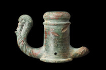 ROMAN BRONZE CHARIOT FITTING WITH SWAN HEAD

 Ca. 100-200 AD
 A bronze chariot fitting in the form of a tubular shaft, adorned with a delicately do...