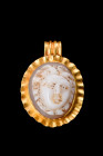 ROMAN GOLD PENDANT WITH CHALCEDONY MEDUSA CAMEO

 Ca. 100-300 AD
 A chalcedony cameo, with its finely carved features and lifelike detail, depicts ...