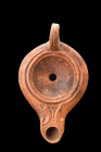 ROMAN TERRACOTTA OIL LAMP

 Ca. 100-200 AD
 A pottery oil lamp with its moulded body featuring a volute spout that elegantly curves outwards, drawi...
