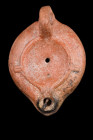 ROMAN TERRACOTTA OIL LAMP

 Ca. 100-200 AD
 A moulded pottery oil lamp characterized by a small spout and a recessed tondo with a central filling h...