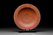 ROMAN TERRA SIGILLATA PLATE

Ca. 300-400 AD.
An ancient Roman wheel-thrown redware pottery bowl with a flared, flat rime, steep walls, and a flat b...