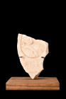 ROMAN MARBLE FRAGMENT WITH FLORAL PATTERN ON STAND

 Ca. 100-300 AD
 A fragment of a marble plaque with an intricate floral pattern in relief. The ...