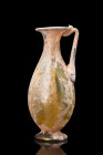 ROMAN GLASS JUG WITH HANDLE

 Ca. 200-300 AD
 A beautiful glass jug featuring a globular body, tapering with impeccable precision to form a tubular...