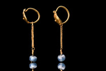 ROMAN GOLD PAIR OF EARRINGS

 Ca. 100-200 AD
 A matched pair of gold earrings. Each earring is a work of art, meticulously crafted from the finest ...