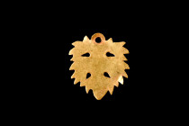 ROMAN GOLD LEAF-SHAPED PENDANT 

 Ca. 100-300 AD
 A gold leaf-shaped pendant with its jagged edges and suspension hole, demonstrates the skill and ...