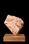 ROMAN TERRACOTTA BRICK WITH STAMP ON STAND 

 Ca. 100-300 AD
 A fragment of terracotta brick featuring a stamp imprint in relief. The imprint is ex...