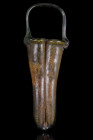 ANCIENT ROMAN GLASS DOUBLE BALSAMARIUM

 Ca. 300-400 AD
 A finely modelled double balsamarium in dark green glass; The vessel is composed of two co...